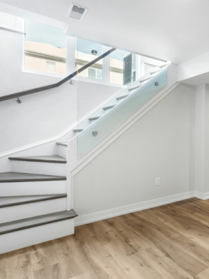 A photo of a basement with stairs leading up to the main level.